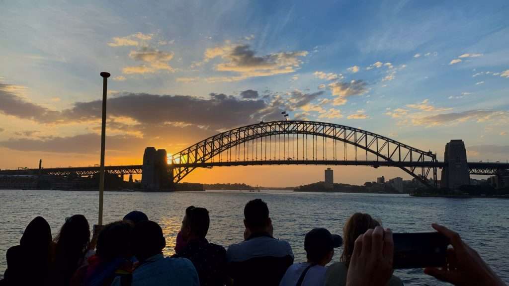 Tourist photographing bridge during Elton John Farewell Tour.
