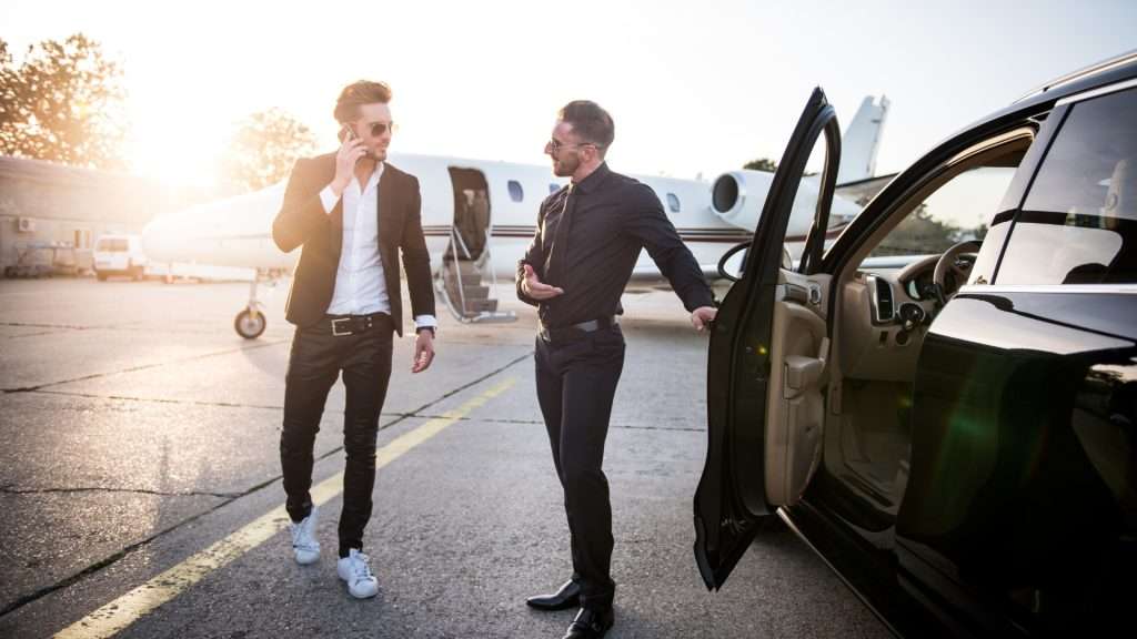 Chauffeur assisting with bags at Gold Coast Airport.