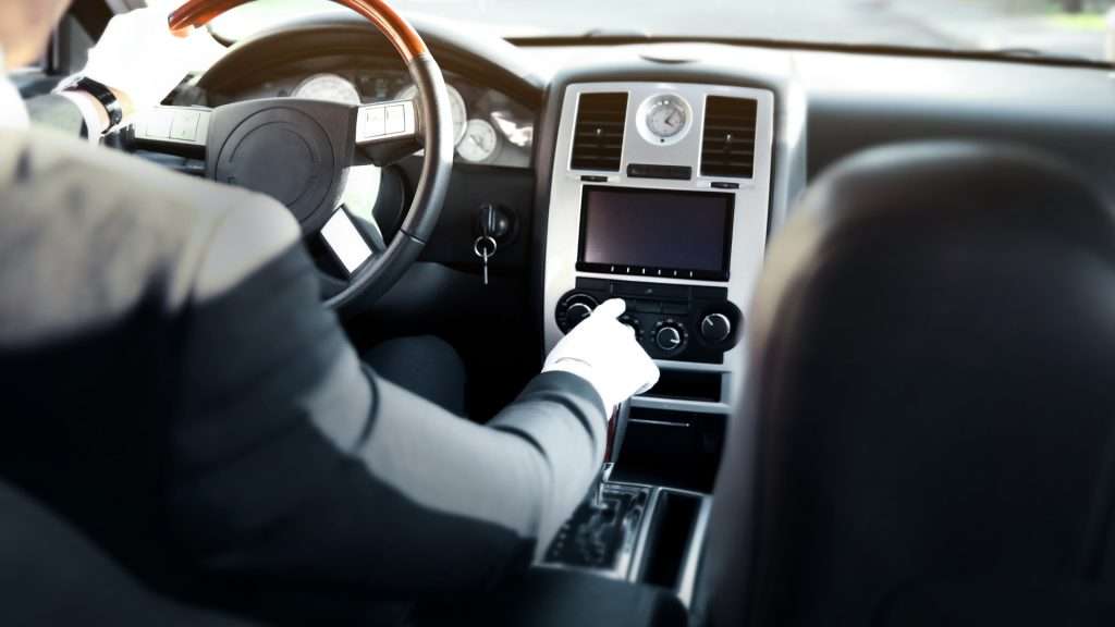 Activities inside luxury chauffeur-driven car interior