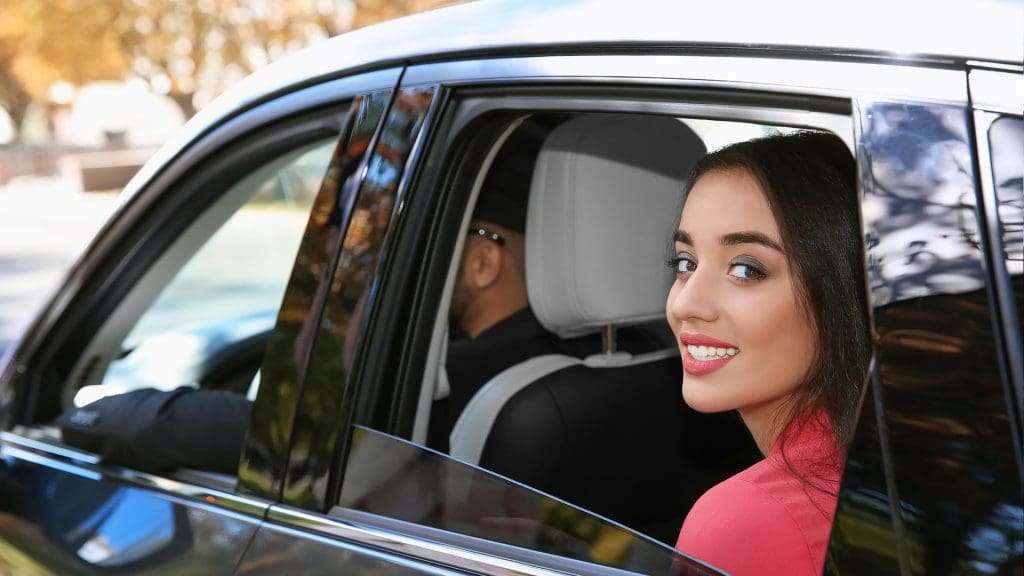 Lady sitting in a luxury car
