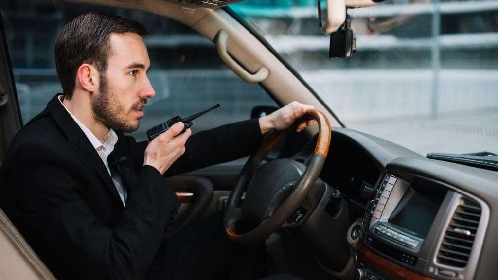 About Corporate Chauffeurs : Chauffeurs using walkie-talkies for global coverage.