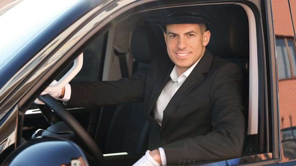 Why Chauffeur Services Stand Out smiling professional driver.
