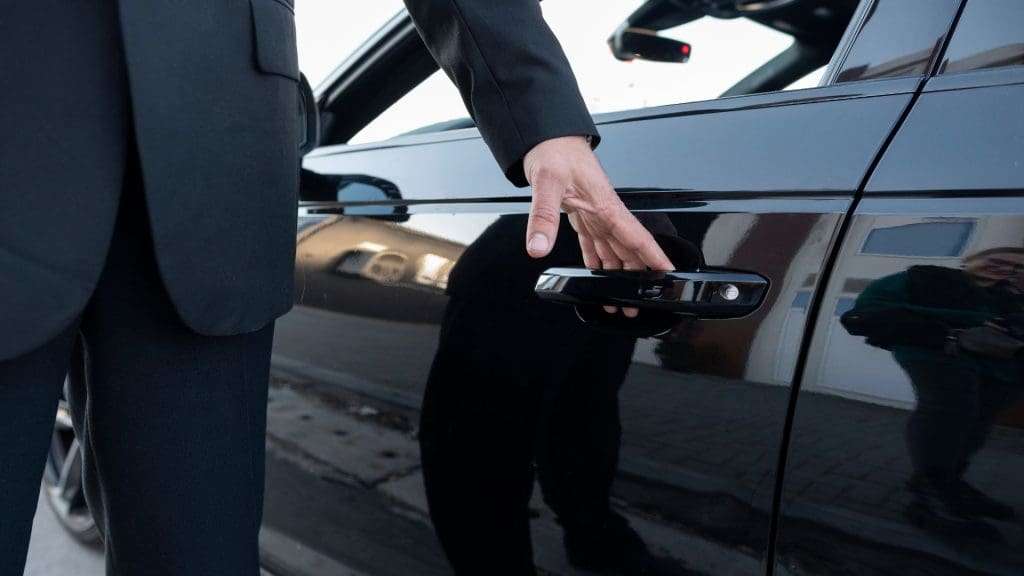 Luxury Car Transportation Services with door assistance.