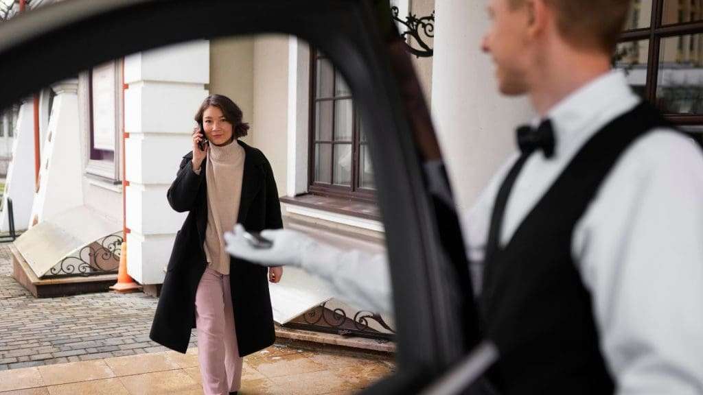 Chauffeur Service at Gold Coast driver welcoming arriving passenger.