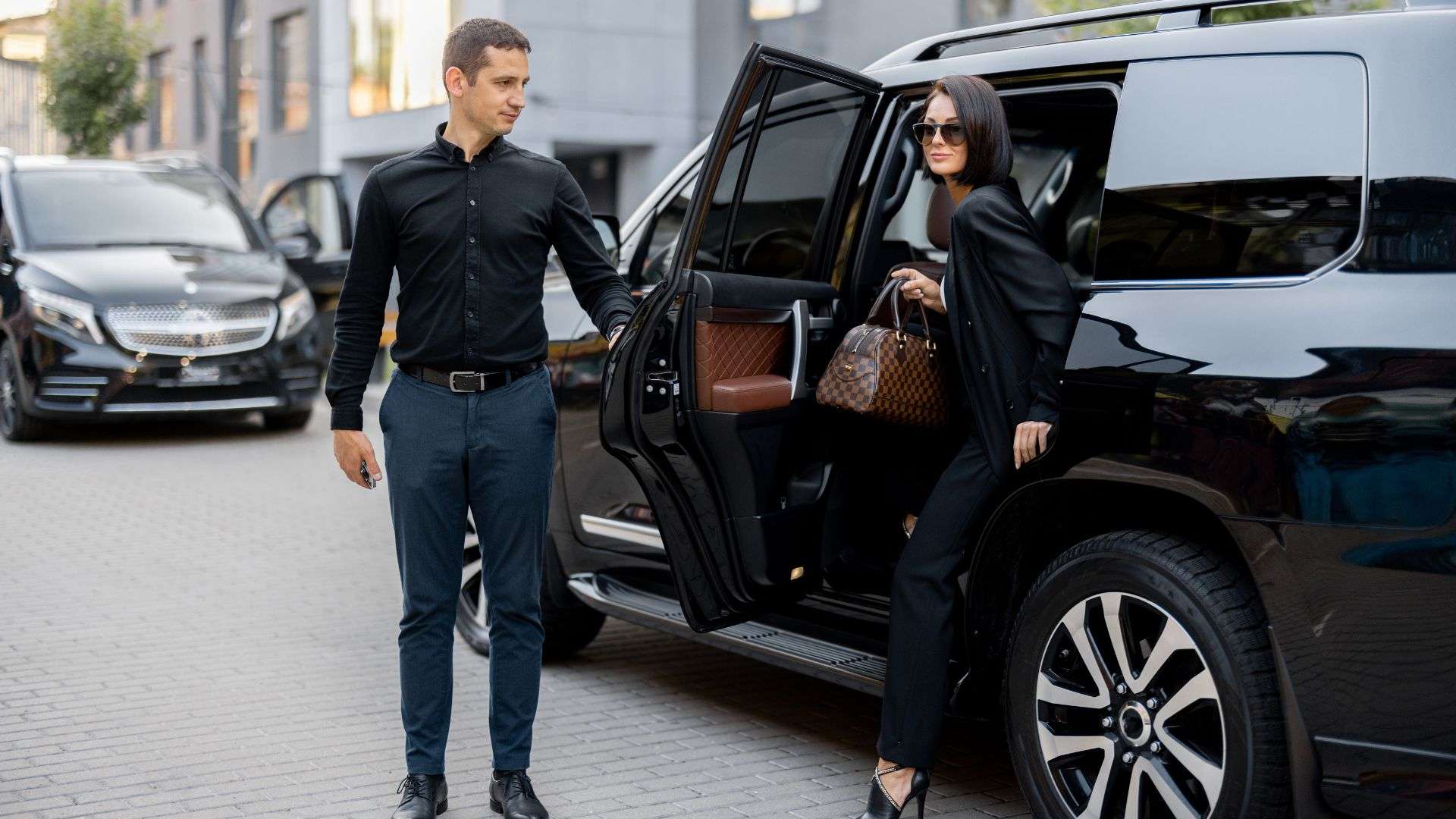 Chauffeur Service Australia driver opening SUV door